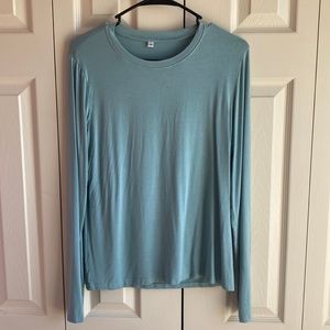 Yoga long sleeve with thumb holes, and openings in back for breath ability.
